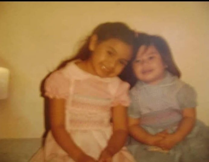 Denise as a child with her sister